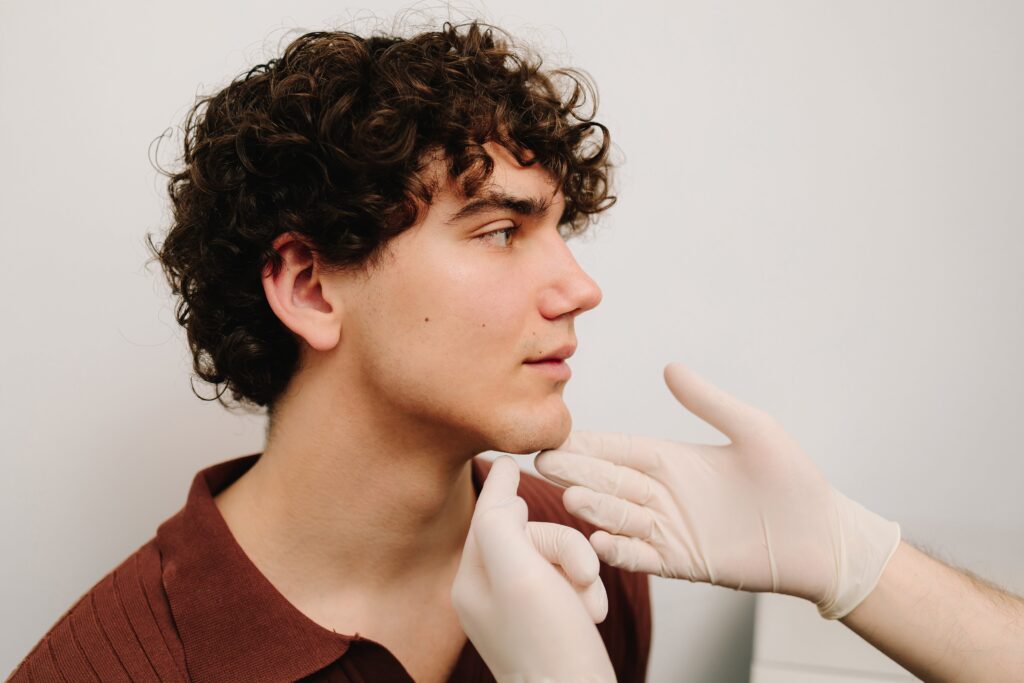 Man consulting doctor about Botox treatment.