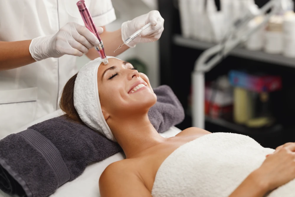 Client receiving multiple treatments in a med spa for facial rejuvenation.