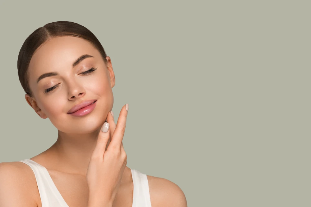 Woman with glowing skin smiling softly after Xeomin treatment