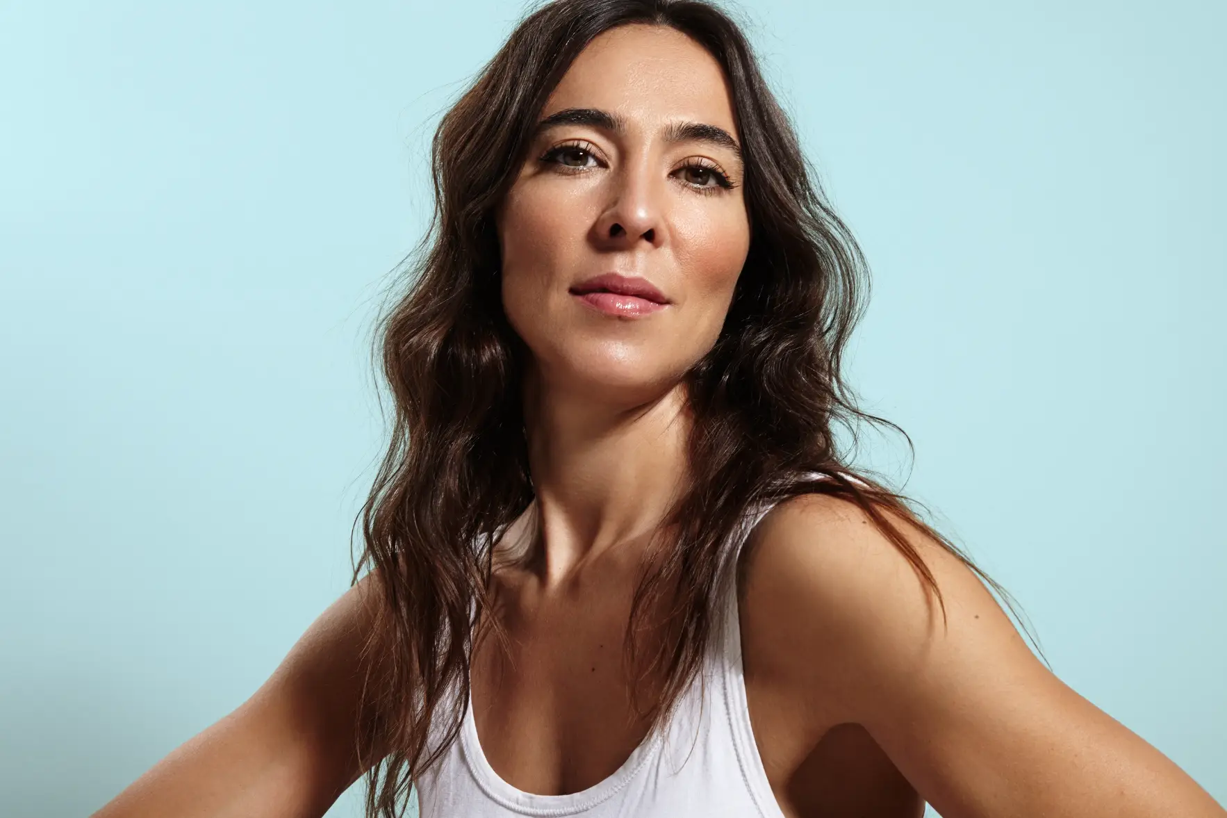 Woman with healthy skin looking confidently at the camera